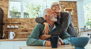 older couple smiling in kitchen